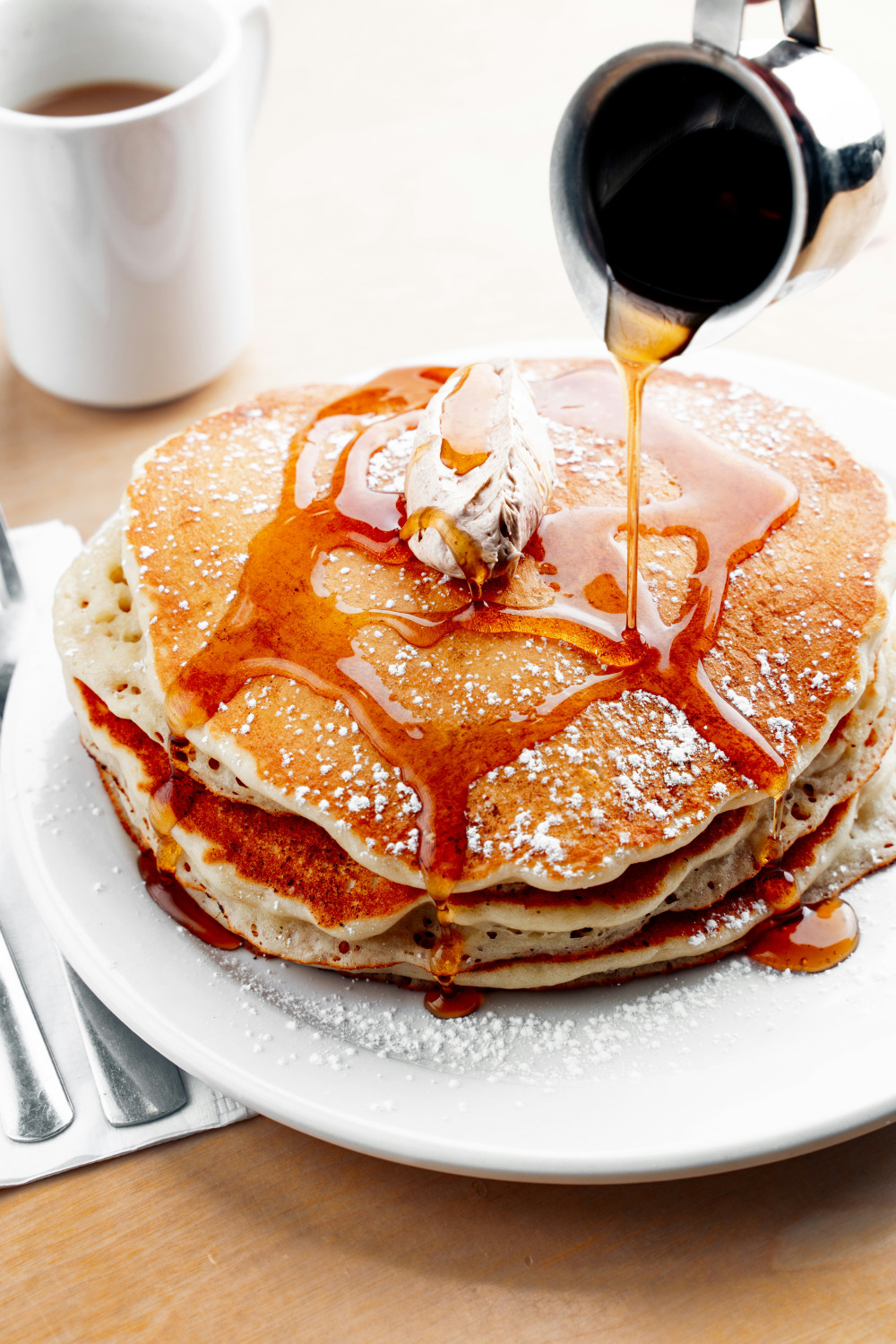Stack of pancakes with maple syrup