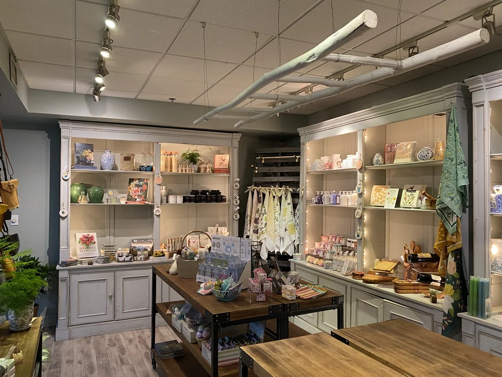 Inside the Purple Pear boutique — shelves of curated gifts